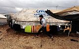 A Syrian refugee boy runs to his family tent at Zaatari Syrian refugee camp, near the Syrian border in Mafraq, Jordan, on January 8, 2013. (AP Photo/Mohammad Hannon)