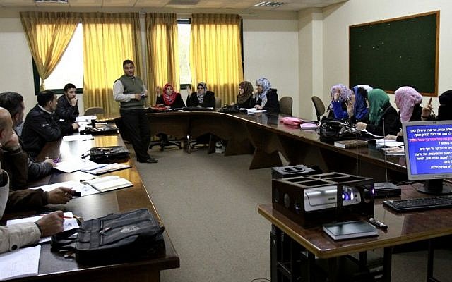 Lecturer Kamal Hamdan, center, teaches a Hebrew conversation class at the Islamic University of Gaza, in Gaza City on Monday (photo credit: AP/Adel Hana) Lecturer Kamal Hamdan, center, teaches a Hebrew conversation class at the Islamic University of Gaza, in Gaza City on Monday (photo credit: AP/Adel Hana)