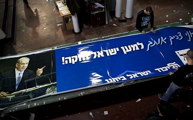 Workers put the finishing touches on election campaign billboard showing Prime Minister and Likud Party leader Benjamin Netanyahu in the central Israeli Town of Petah Tikva. Palestinian officials largely view Netanyahu's expected re-election with despair, fearing the Israeli hardliner's ambitious plans for settlement construction over the next four years could prove lethal to their dreams of a state. The Hebrew on billboards reads "I need you for strong Israel." (AP Photo/Oded Balilty) Workers put the finishing touches on election campaign billboard showing Prime Minister and Likud Party leader Benjamin Netanyahu in the central Israeli Town of Petah Tikva. Palestinian officials largely view Netanyahu's expected re-election with despair, fearing the Israeli hardliner's ambitious plans for settlement construction over the next four years could prove lethal to their dreams of a state. The Hebrew on billboards reads "I need you for strong Israel." (AP Photo/Oded Balilty)