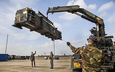 Dutch military trucks -- carrying NATO's Patriot missile defense system to protect Turkey in case neighboring Syria launches an attack -- being unloaded at Incirnik base, near Adana, Turkey, Thursday, January 24, 2013. (photo credit: AP/Rob van Eerden, Dutch Defense Ministry, HO)
