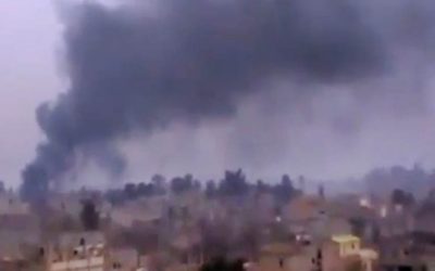 Smoke rises from heavy shelling in Deir el-Zour, Syria, on Monday, January 28, 2013. (photo credit: AP Photo/Ugarit News via AP video)