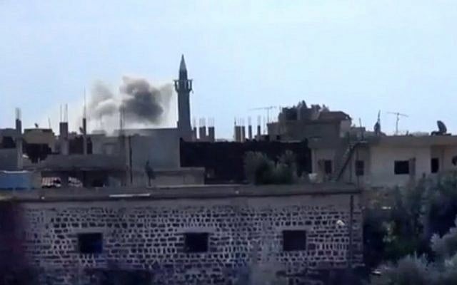 In this image captured from a video obtained from the Shaam News Network, which has been authenticated based on its contents and other AP reporting, smoke rises from buildings due to heavy shelling in Daraa, Syria, Thursday (AP Photo/Shaam News Network via AP video) In this image captured from a video obtained from the Shaam News Network, which has been authenticated based on its contents and other AP reporting, smoke rises from buildings due to heavy shelling in Daraa, Syria, Thursday (AP Photo/Shaam News Network via AP video)