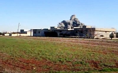 Smoke rises due to heavy shelling in Taftanaz, Idlib province, northern Syria, on Thursday, January 10, 2013. (photo credit: Shaam News Network/AP)