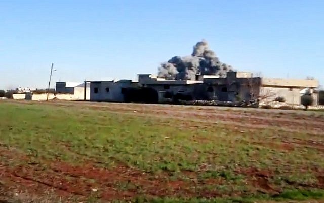 Smoke rises due to heavy shelling in Taftanaz, Idlib province, northern Syria, on Thursday, January 10, 2013. (photo credit: Shaam News Network/AP)