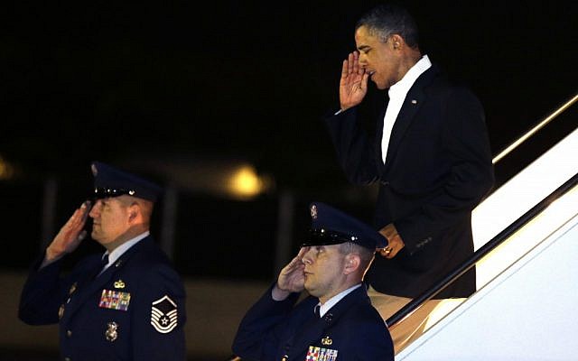 US President Barack Obama salutes as he gets off Air Force One upon his arrival at Joint Base Pearl Harbor-Hickam in Honolulu, Hawaii on Wednesday. (photo credit: AP/Gerald Herbert) US President Barack Obama salutes as he gets off Air Force One upon his arrival at Joint Base Pearl Harbor-Hickam in Honolulu, Hawaii on Wednesday. (photo credit: AP/Gerald Herbert)