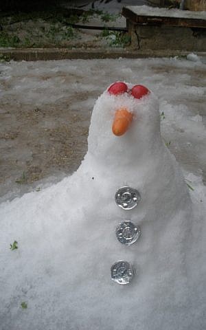 A tiny snowman in Jerusalem. (photo credit: Gabe Fisher/Times of Israel staff) A tiny snowman in Jerusalem. (photo credit: Gabe Fisher/Times of Israel staff)