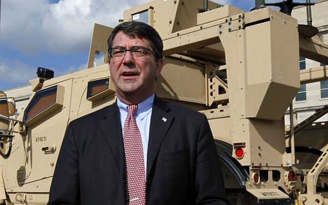 Deputy Defense Secretary Ashton Carter standing in front of a MRAP all terrain vehicle (M-ATV) at the Pentagon in Washington, in 2009 (photo credit: AP/Manuel Balce Ceneta, File)