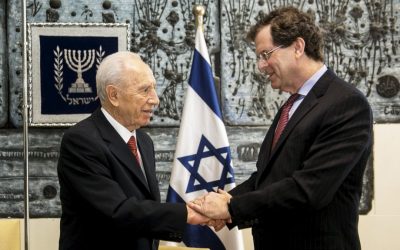President Shimon Peres shakes hands with AJC Executive Director David Harris during a meeting in Israel (photo credit: Olivier Fitoussi)