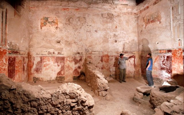The concept of the exhibit is to portray several stages of Herod's life, based on what is known from his architectural projects, and what has been found in his various palaces. Here, Professor Ehud Netzer and Roi Porat in the many-frescoed VIP room of the theater at Herodium, at the end of the excavation, which has been partially recreated in the Israel Museum exhibit (Courtesy Israel Museum)