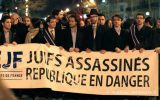 Members of the Union of French Jewish Students demonstrate in Paris in 2013 with a sign that reads, "Jews murdered, republic endangered." (Courtesy of UEJF via JTA)