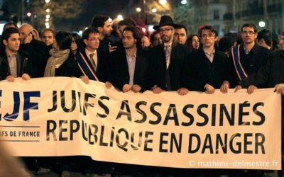 Members of the Union of French Jewish Students demonstrate in Paris in 2013 with a sign that reads, "Jews murdered, republic endangered." (Courtesy of UEJF via JTA)