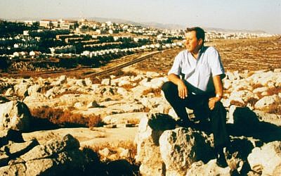 Ron Nachman perched on a rock (photo credit: Avi Zimmerman/Ariel Development Fund)
