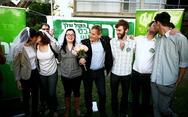 Meretz party member Nitzan Horowitz (center) conducts a gay marriage ceremony outside the rabbinical court in Tel Aviv, Thursday, January 3, 2013 (photo credit: Flash90) Meretz party member Nitzan Horowitz (center) conducts a gay marriage ceremony outside the rabbinical court in Tel Aviv, Thursday, January 3, 2013 (photo credit: Flash90)