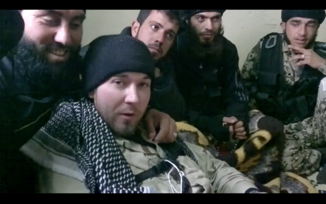 An alleged American (front) fighting with Syrian rebels against Syrian President Bashar Assad. (photo credit: image capture from YouTube video) An alleged American (front) fighting with Syrian rebels against Syrian President Bashar Assad. (photo credit: image capture from YouTube video)
