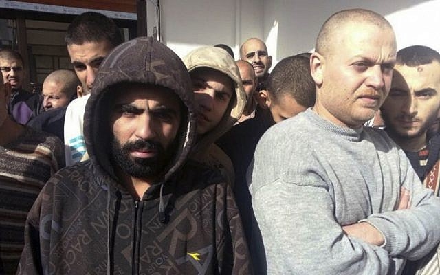 In this photo provided by the Turkish Islamic aid group IHH, freed Syrian prisoners released by the Syrian government are seen in Damascus, Syria, Wednesday, Jan. 9, 2013. (photo credit:AP/IHH) In this photo provided by the Turkish Islamic aid group IHH, freed Syrian prisoners released by the Syrian government are seen in Damascus, Syria, Wednesday, Jan. 9, 2013. (photo credit:AP/IHH)