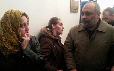 In this photo provided by the Turkish Islamic aid group IHH, the group's chairman, Bulent Yildirim right, speaks with freed Syrian prisoners in Damascus, Syria, Wednesday, Jan. 9, 2013 (photo credit: AP/IHH)