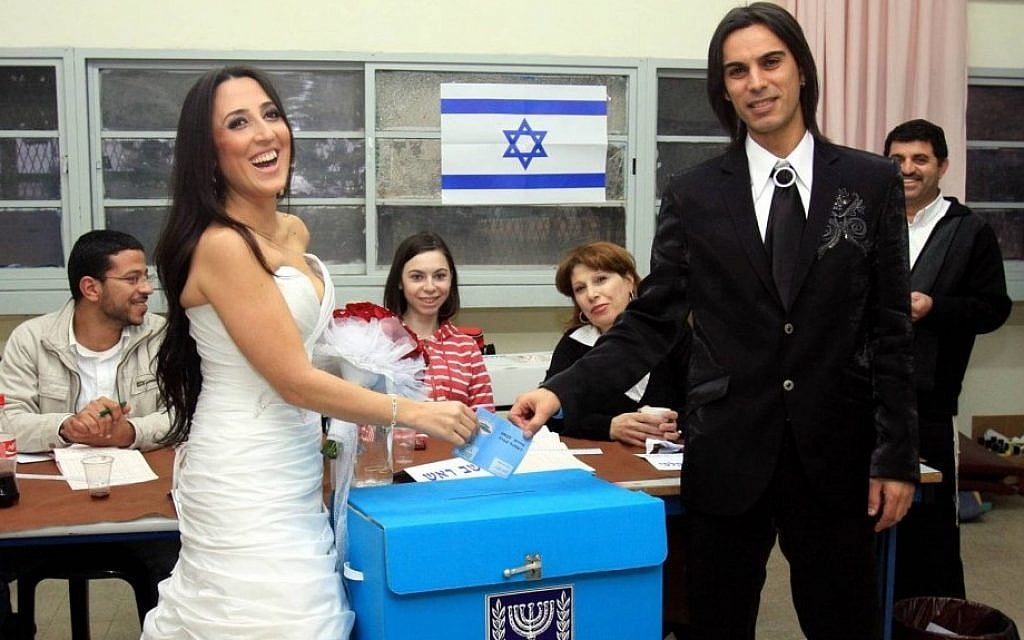 Casting their lot. A bride and groom vote in the last general elections before getting married, February 10, 2009. (Photo credit: by Edi Israel/Flash90) Casting their lot. A bride and groom vote in the last general elections before getting married, February 10, 2009. (Photo credit: by Edi Israel/Flash90)