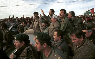 Yasser Arafat is cheered on by supporters as he visits the West Bank city of Hebron, January 19, 1997 (photo credit: Nati Shohat/Flash90)