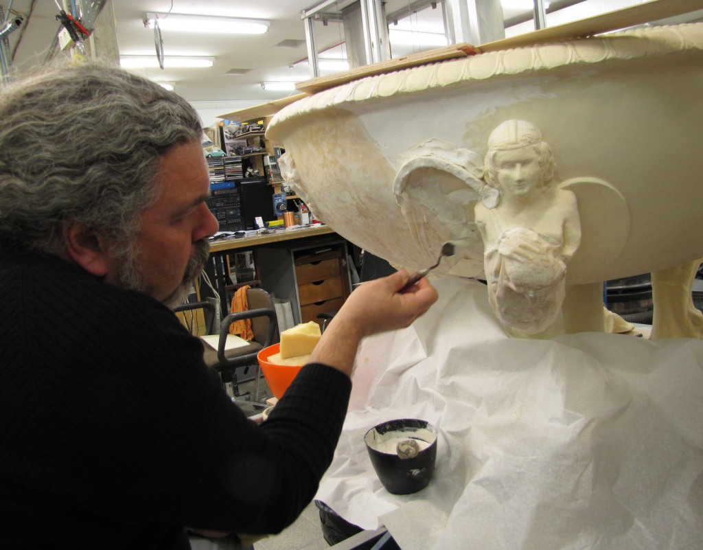 Victor Uziel, a restorer at the Israel Museum laboratories, working on a footed marble basin decorated with a winged female figure. The basin was probably given to Herod as a gift from Emperor Augustus or his second in command, Marcus Agrippa (photo credit: Andrei Vainer)