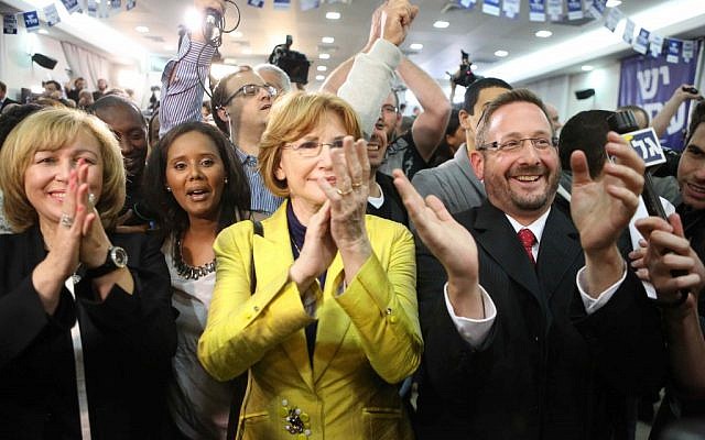 Yesh Atid candidates, from left, Rina Frankel, Penina Tamnu-Shata, Yael German and Dov Lipman, respond to preliminary exit poll results on January 22, 2013. (photo credit: Flash90)