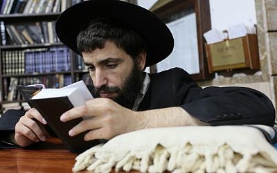 An ultra-Orthodox Jewish man prays at the 770 building in Kfar Chabad, Israel (photo credit: Nati Shohat/Flash90/File)