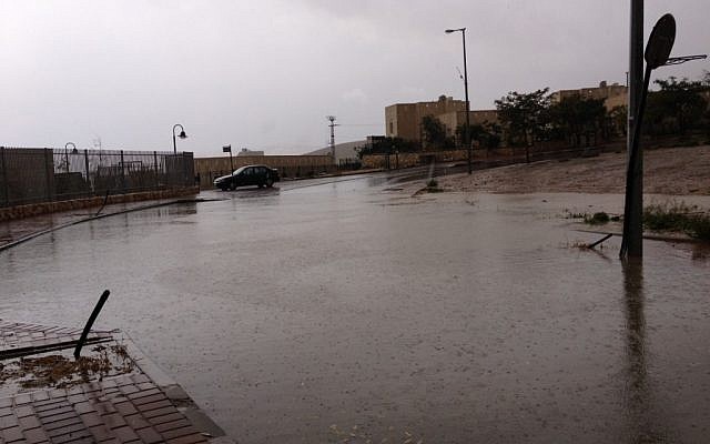 Flooded street in Kfar Adumim (photo credit: Amanda Borschel-Dan/Times of Israel)