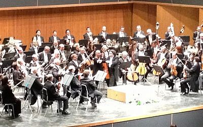 Gustavo Dudamel conducting the Israel Philharmonic in Jerusalem last week, at the International Convention Center (photo credit: Jessica Steinberg/Times of Israel)