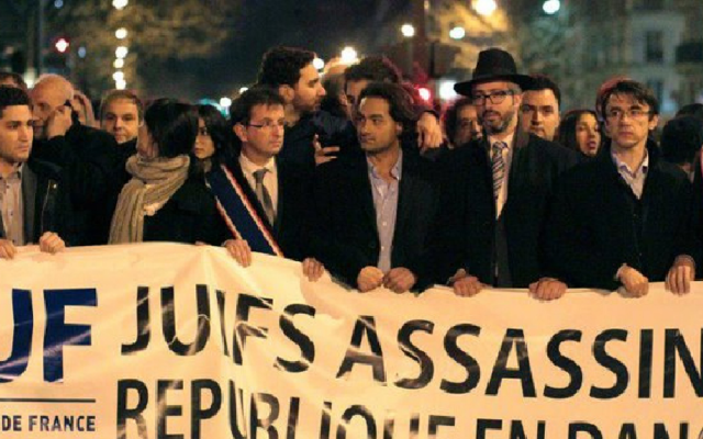 Members of the Union of French Jewish Students demonstrate in Paris with a sign that reads, 'Jews murdered, republic endangered.' (Courtesy of UEJF via JTA) Members of the Union of French Jewish Students demonstrate in Paris with a sign that reads, 'Jews murdered, republic endangered.' (Courtesy of UEJF via JTA)