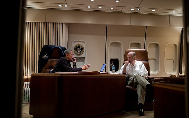 Barack Obama, left, speaking on the phone on Air Force One, while adviser Tom Donilon looks on, in November. (photo credit: Pete Souza/Official White House photo)