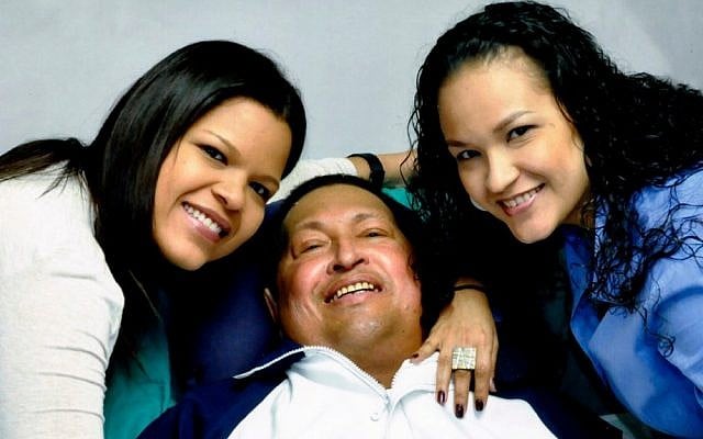 In this photo released in January, Venezuela's President Hugo Chavez, center, poses for a photo with his daughters, Maria Gabriela, left, and Rosa Virginia at an unknown location in Havana, Cuba (photo credit: AP/Miraflores Presidential Press Office)