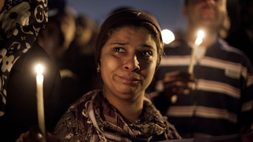 Demonstrators hold a vigil on Saturday for a protestor who died this past week during clashes with police in Cairo, Egypt (photo credit: AP/Virginie Nguyen Hoang)