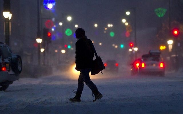 A woman crosses Congress Street during a snowstorm in Portland, Maine, Friday. Snow began falling across the Northeast on Friday, ushering in what was predicted to be a huge, possibly historic blizzard and sending residents scurrying to stock up on food and gas up their cars. The storm could dump 1 to 3 feet of snow from New York City to Boston and beyond. (AP Photo/Robert F. Bukaty) A woman crosses Congress Street during a snowstorm in Portland, Maine, Friday. Snow began falling across the Northeast on Friday, ushering in what was predicted to be a huge, possibly historic blizzard and sending residents scurrying to stock up on food and gas up their cars. The storm could dump 1 to 3 feet of snow from New York City to Boston and beyond. (AP Photo/Robert F. Bukaty)