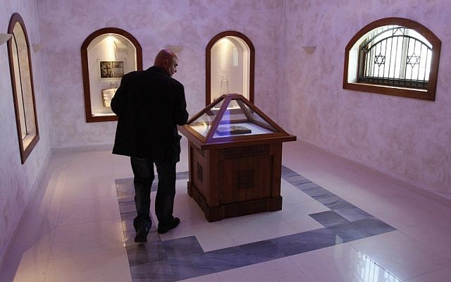 Bosnian conservationist technician Hamo Karkelja looks at original book of Sarajevo Haggadah, displayed at the National Museum of Bosnia and Herzegovina in Sarajevo, Bosnia, 2010 (photo credit: Amel Emric/AP) Bosnian conservationist technician Hamo Karkelja looks at original book of Sarajevo Haggadah, displayed at the National Museum of Bosnia and Herzegovina in Sarajevo, Bosnia, 2010 (photo credit: Amel Emric/AP)