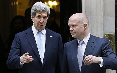 US Secretary of State John Kerry, left, walks with British Foreign Secretary William Hague in London in February. The two leaders are taking part in a G8 foreign ministers meeting Wednesday and Thursday, also in London. (photo credit: AP Photo/Kirsty Wigglesworth)