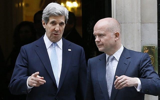 US Secretary of State John Kerry, left, walks with British Foreign Secretary William Hague in London in February. The two leaders are taking part in a G8 foreign ministers meeting Wednesday and Thursday, also in London. (photo credit: AP Photo/Kirsty Wigglesworth)