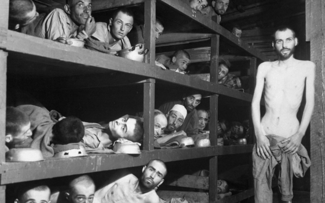 Inmates at the Buchenwald concentration camp, days after liberation. Famed author Elie Wiesel is second row from the bottom, seventh from the left, next to the bunk post. (US Army/US Defense Visual Information Center/Wikimedia Commons)