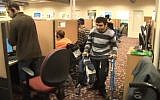 Disabled employees report to work at Call Yachol (photo credit: image capture YouTube)
