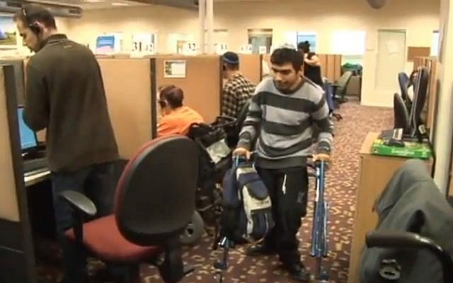 Disabled employees report to work at Call Yachol (photo credit: image capture YouTube) Disabled employees report to work at Call Yachol (photo credit: image capture YouTube)
