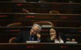 Prime Minister Benjamin Netanyahu and Labor Party leader Shelly Yachimovich speak during a meeting at the Knesset (photo credit: Michal Fattal/Flash90)