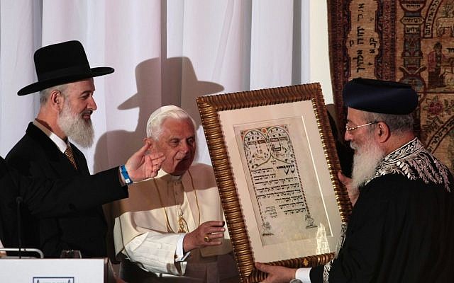 Chief rabbis Yona Metzger, left, and Shlomo Amar, right, presenting Pope Benedict XVI with an illustrated text in Jerusalem in 2009. (photo credit: Kobi Gideon/Flash90)