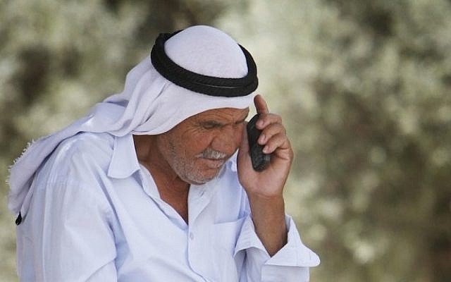 An Israeli Arab speaks on a cellphone (Miriam Alster/Flash90)