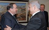 Former Arkansas governor Mike Huckabee meets Prime Minister Benjamin Netanyahu in Jerusalem during a 2011 visit (with actor Jon Voight in the background). (Amos Ben Gershom/ GPO/Flash90)