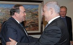 Former Arkansas governor Mike Huckabee meets Prime Minister Benjamin Netanyahu in Jerusalem during a 2011 visit (with actor Jon Voight in the background). (Amos Ben Gershom/ GPO/Flash90)