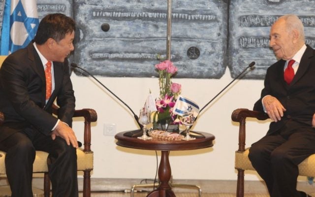 South Korean ambassador to Israel Kim Il-soo, left, with Presiden Shimon Peres at a welcoming ceremony for newly appointed ambassadors, held at the president's residence in Jerusalem. December 14, 2011. (photo credit: Isaac Harari/Flash90)