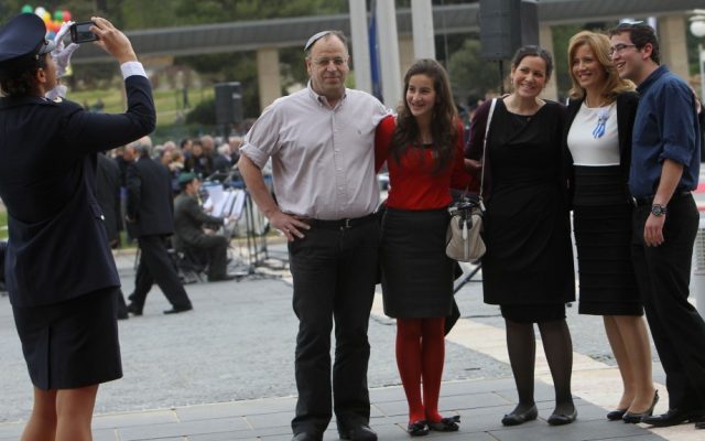 Aliza Lavie of Yesh Atid seen posing with her family at the Knesset (photo credit: Miriam Alster/Flash90)