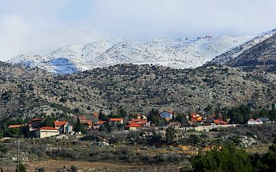 The northernmost Jewish village in the Golan, Neve Ativ, beneath Mount Hermon (photo credit: Moshe Shai/Flash 90)