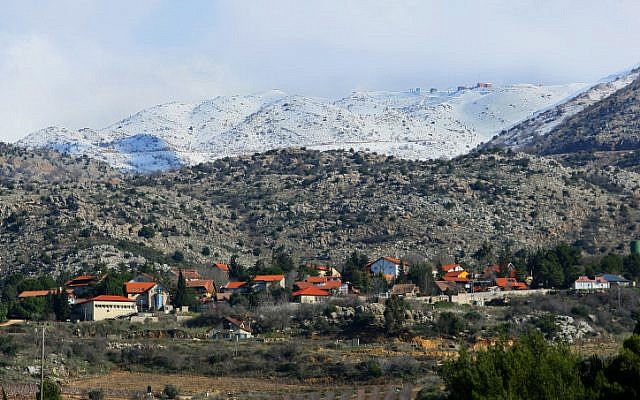 The northernmost Jewish village in the Golan, Neve Ativ, beneath Mount Hermon (Photo credit: Moshe Shai/ Flash 90) The northernmost Jewish village in the Golan, Neve Ativ, beneath Mount Hermon (Photo credit: Moshe Shai/ Flash 90)