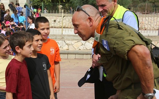An officer from the Home Front Command talks to students during an emergency drill at an Israeli school, October 2012 (photo credit: Oren Nahshon/Flash90) An officer from the Home Front Command talks to students during an emergency drill at an Israeli school, October 2012 (photo credit: Oren Nahshon/Flash90)