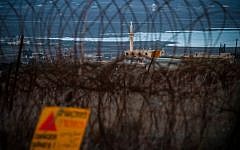 A sign warns of mines near the Syrian border with Israel in the Golan Heights (photo credit: Flash90)