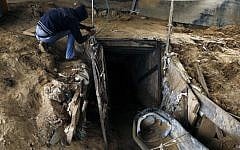 A Palestinian man works outside a smuggling tunnel which connects the Gaza Strip and Egypt in Rafah, southern Gaza Strip on November 24, 2012 (photo credit: Abed Rahim Khatib/Flash90)